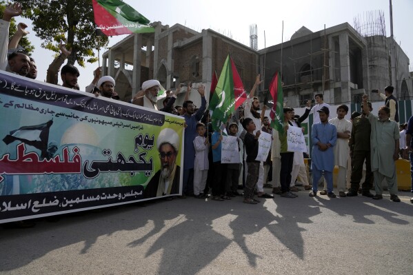 Shiite Muslims chant slogans against Israeli airstrikes on Gaza during a demonstration to show solidarity with Palestinian people, in Islamabad, Pakistan, Friday, Oct. 13, 2023. (AP Photo/Anjum Naveed)